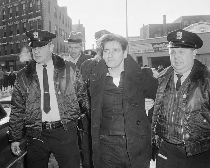 Albert DeSalvo, 35, is surrounded by police after his capture in Lynn, Ma. on Feb. 25, 1967. DeSalvo was nabbed in a store a day after he escaped from Bridgewater State Hospital for the criminally insane. (AP Photo)
